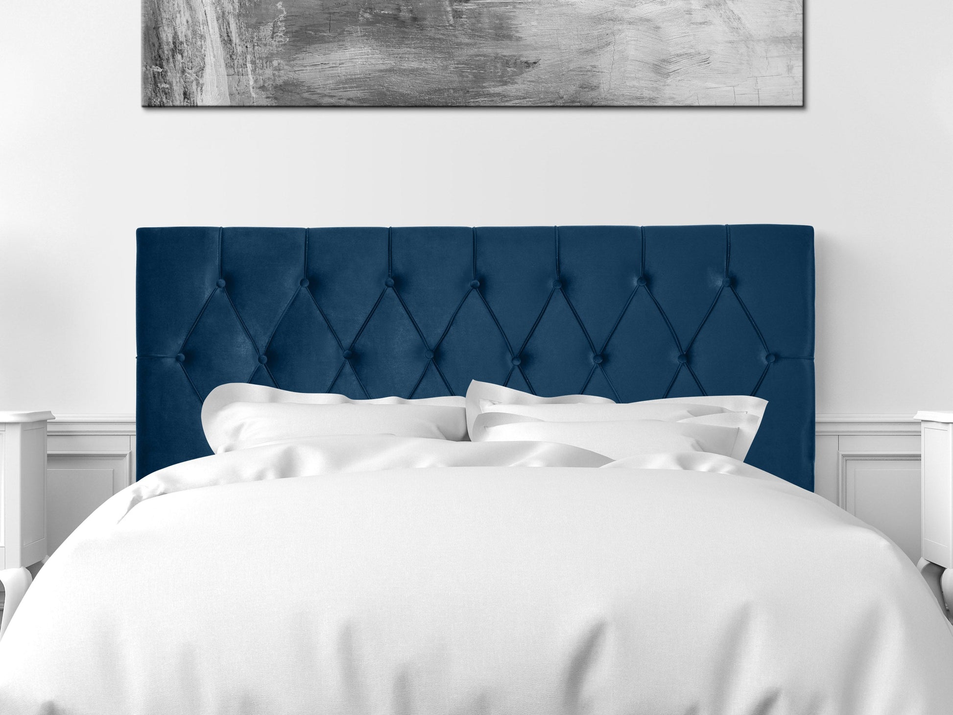 Navy blue velvet queen-sized headboard with tufted design, soft texture, and sturdy construction. Ideal for modern and elegant bedroom decor.