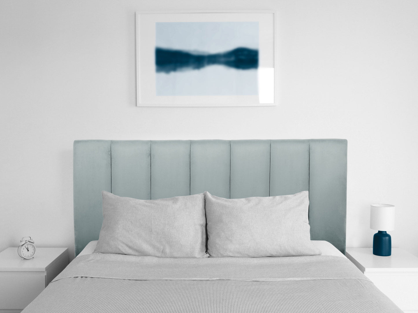 Light blue panel headboard for full/double bed, featuring a minimalist design with clean lines and a soft fabric texture, ideal for modern bedroom decor.