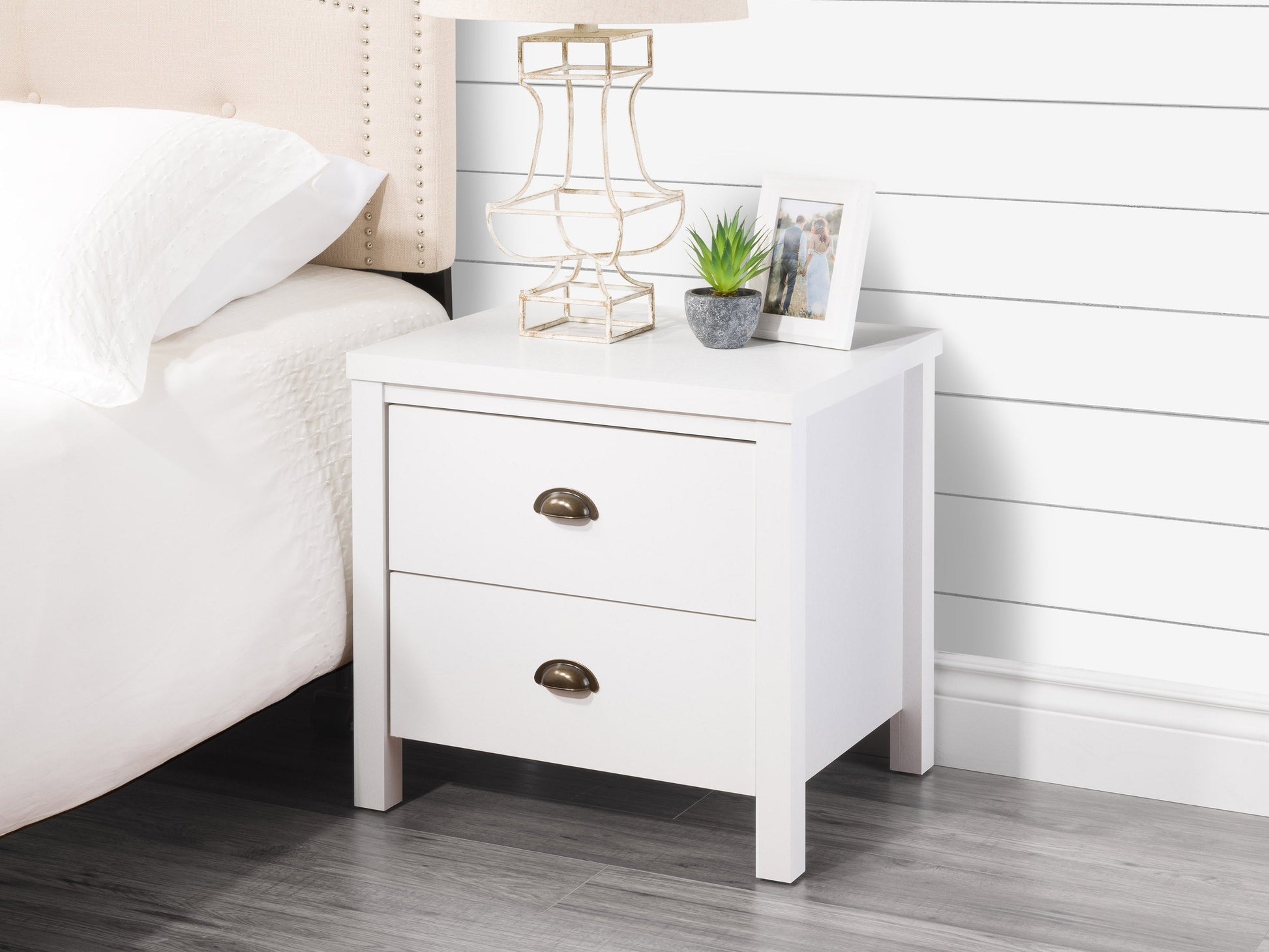 White wooden 2-drawer night stand with sleek metal handles, smooth finish, and modern design. Ideal for bedroom storage and decor.