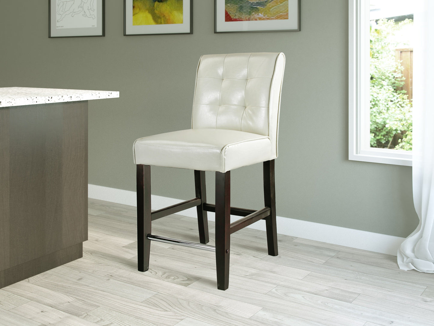 Cream counter height bar stool with a cushioned seat, wooden legs, and footrest. Features a sleek, modern design with a neutral color palette, perfect for kitchen islands or home bars.