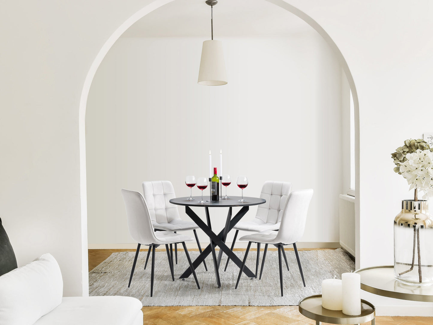 Black dining room set with four cushioned light grey chairs and a rectangular black wooden table, featuring sleek modern design, sturdy construction, and comfortable seating for a contemporary dining experience.