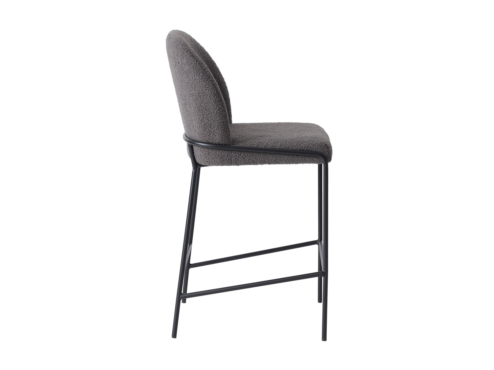 Grey boucle bar stool with plush texture, featuring a curved backrest, black metal legs, and footrest, perfect for modern kitchens and home bars.