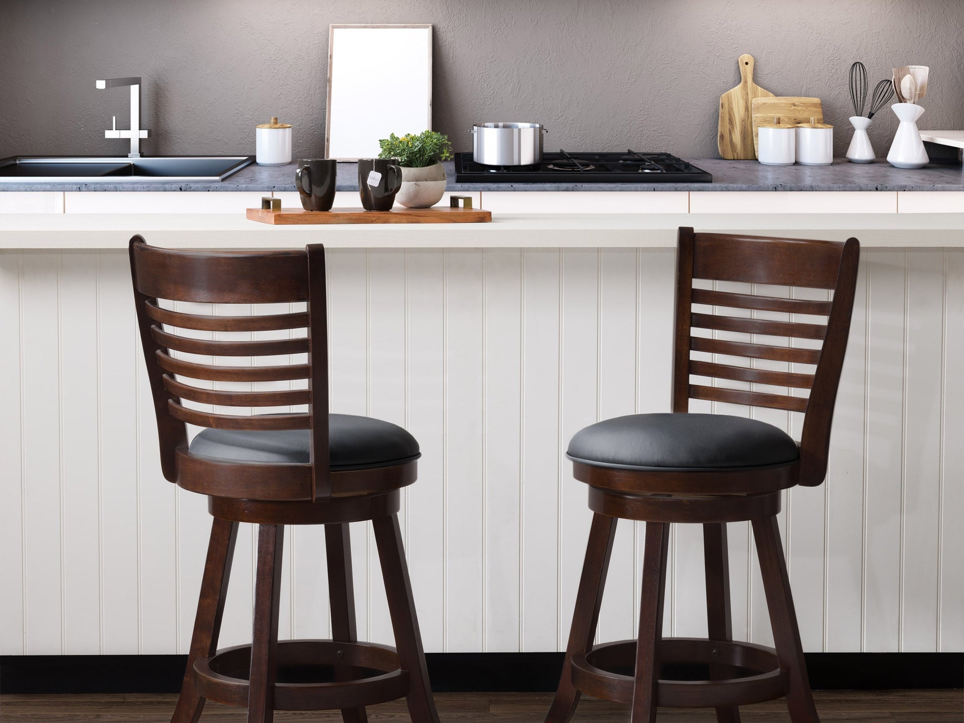 Black counter height bar stools, set of 2, featuring sleek metal frames, cushioned seats in faux leather, and footrests for added comfort. Ideal for modern kitchens, home bars, or dining areas.