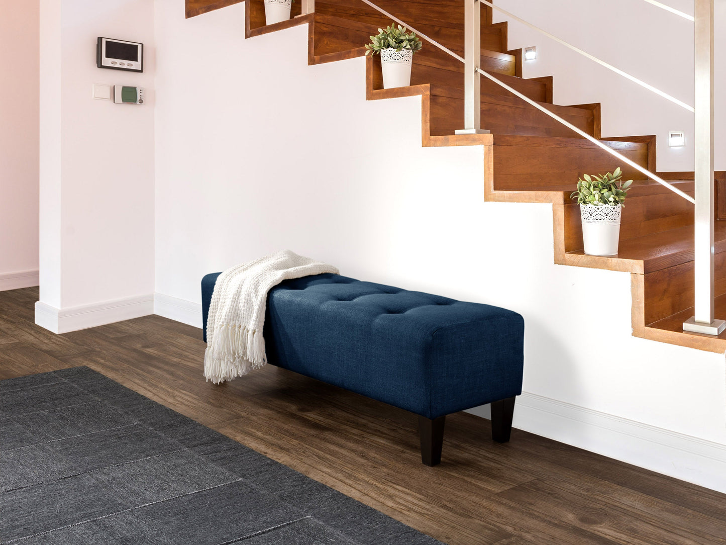 Navy blue accent bench with tufted velvet upholstery, gold metal legs, and a sleek modern design. Perfect for living rooms or entryways, providing both style and comfort.