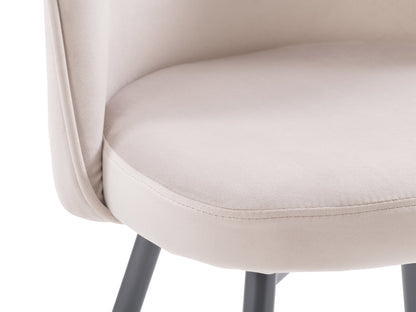 Beige velvet dining chair with gold metal legs, tufted backrest, and curved, modern design.