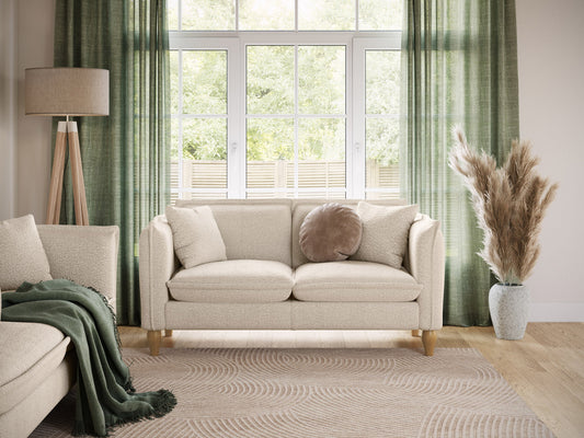 Modern boucle loveseat in cream, featuring soft textured fabric, sleek wooden legs, and plush cushioning for comfort and style, perfect for contemporary living rooms or cozy reading nooks.