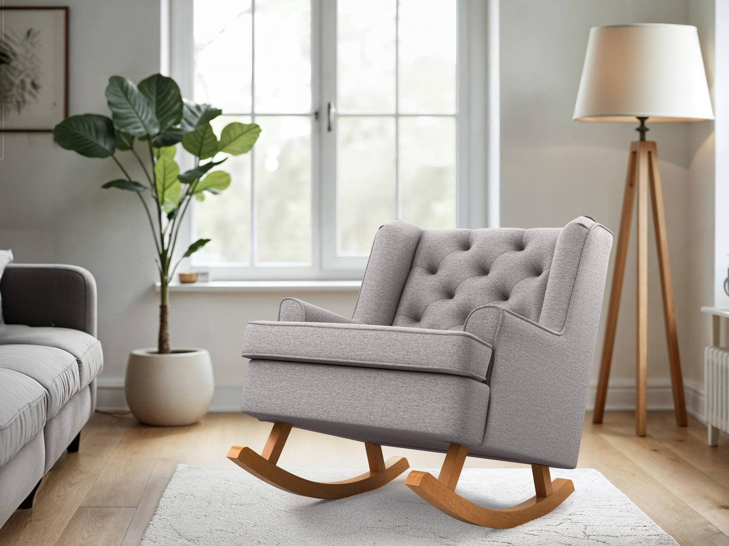 Light grey upholstered rocking chair with wooden legs, featuring a high back and cushioned seat for comfort. Ideal for living rooms and nurseries, blending modern design with timeless elegance.