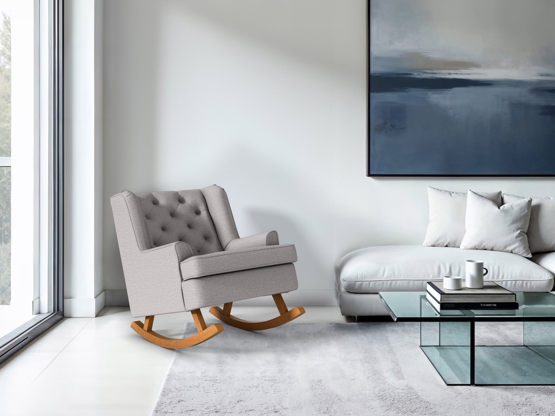 Light grey upholstered rocking chair with wooden legs, featuring a high back and cushioned seat for comfort. Ideal for living rooms and nurseries, blending modern design with timeless elegance.