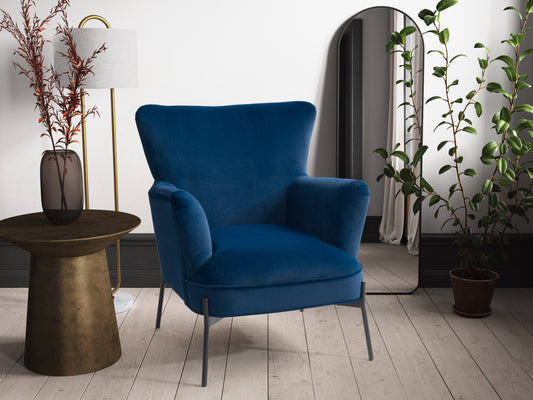 Blue modern wingback accent chair with tufted backrest, wooden legs, and soft velvet upholstery, perfect for living room or bedroom decor.