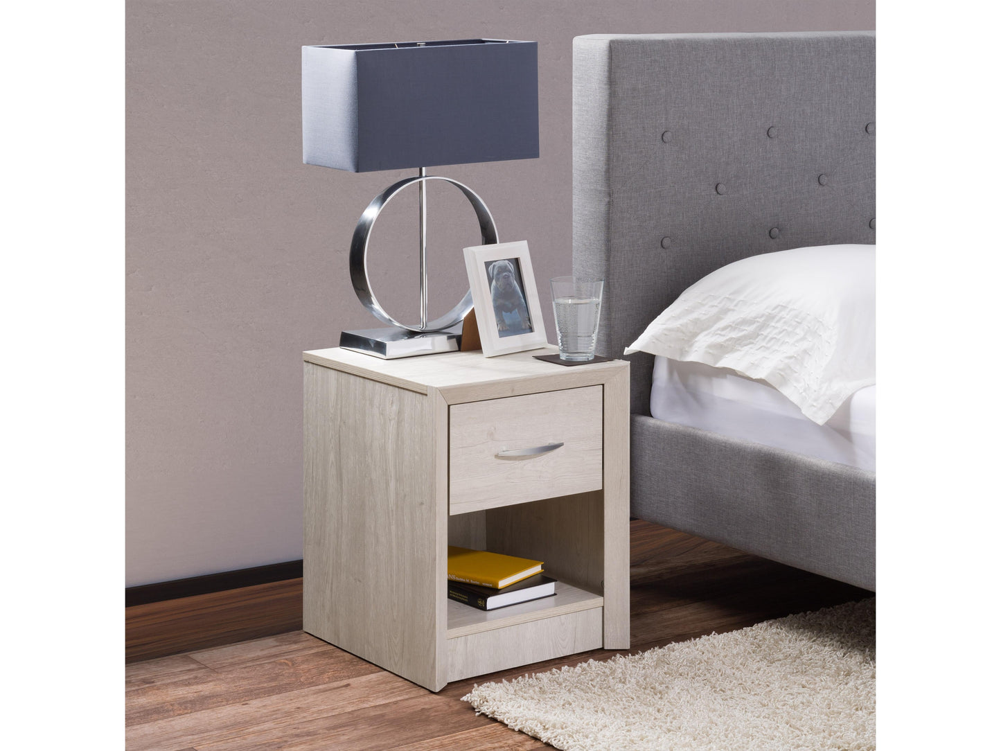 White washed oak mid-century modern night stand featuring sleek lines, two spacious drawers with minimalist handles, and tapered wooden legs. Perfect for bedroom storage and stylish decor.