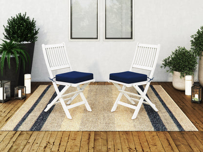 Set of 2 washed white outdoor wood folding chairs with slatted back and seat, featuring durable weather-resistant finish, ideal for patio or garden use.