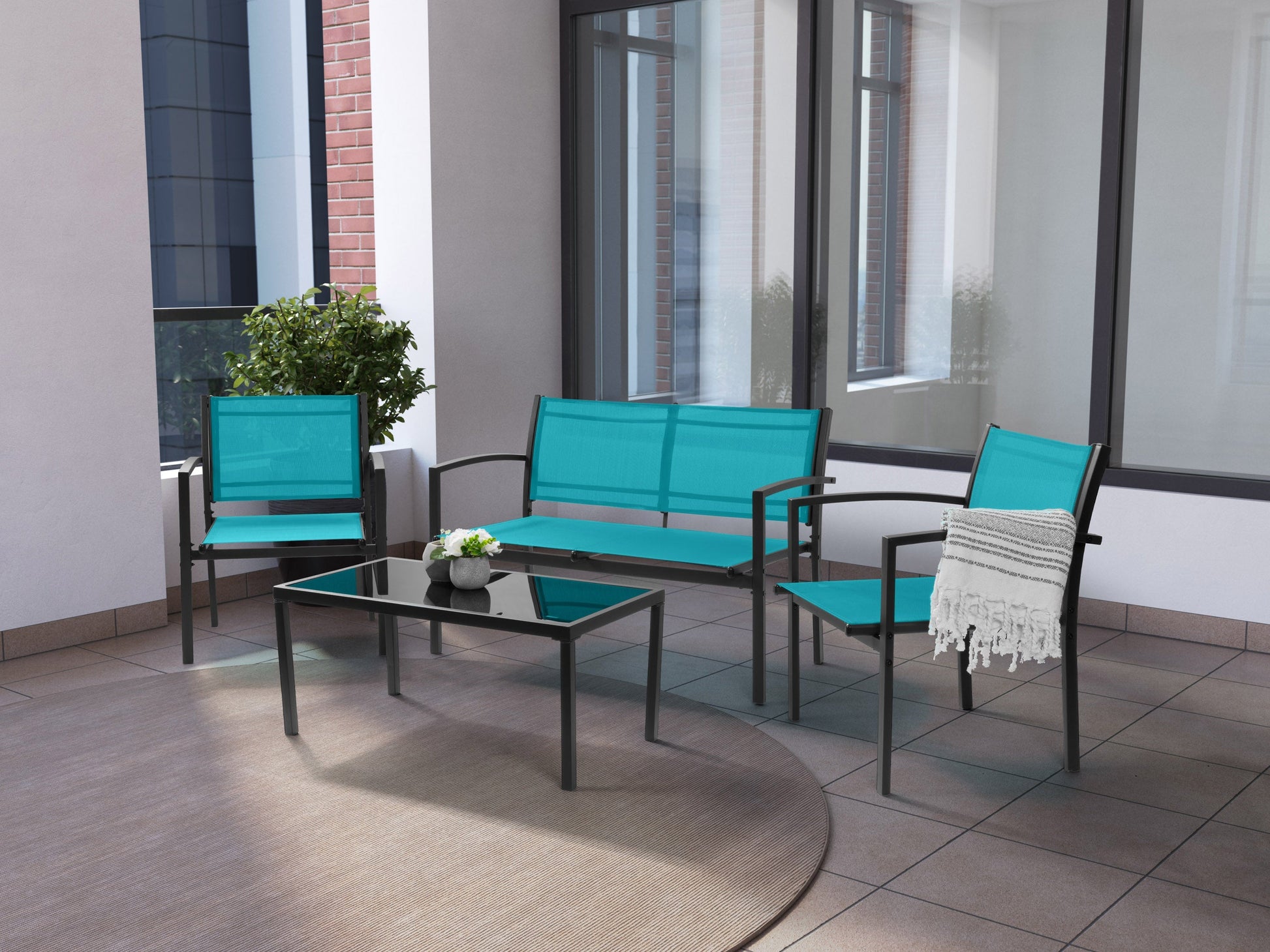 Teal metal outdoor conversation set with 4 pieces, including a loveseat, two armchairs, and a coffee table. Features weather-resistant cushions, sleek metal frames, and a modern design perfect for patios or gardens.