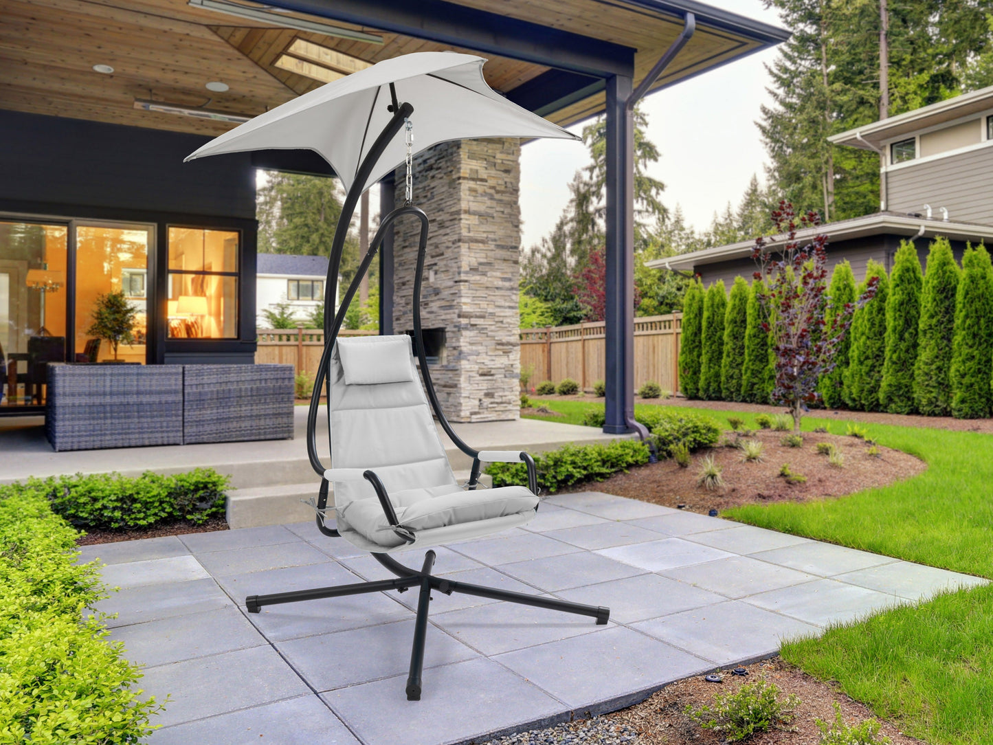 Light grey patio swing lounge chair with cushioned seat and backrest, sturdy metal frame, and adjustable canopy for shade. Ideal for outdoor relaxation and comfort in gardens or patios.