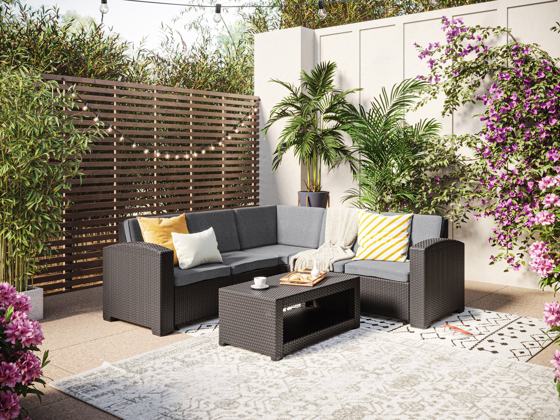 Black and grey outdoor wicker sectional set with six pieces, featuring a modern design, durable wicker material, comfortable grey cushions, and a modular layout perfect for patios and outdoor spaces.