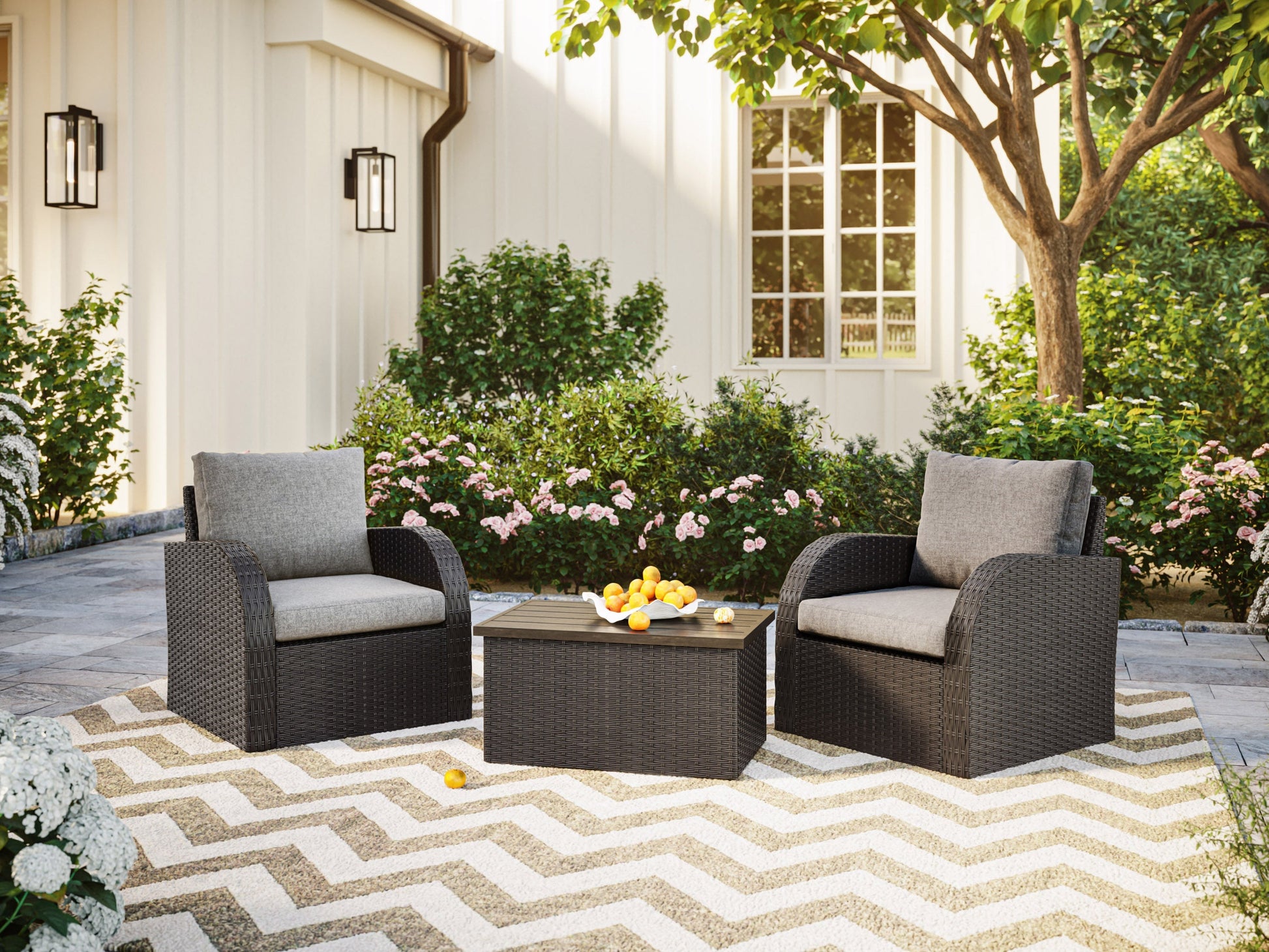 Grey outdoor wicker patio conversation set with a round table and four matching chairs, featuring durable, weather-resistant materials and comfortable cushions for stylish and functional outdoor seating.