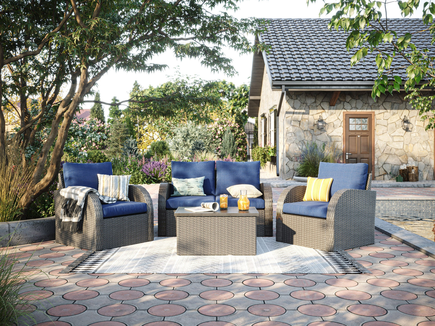 Blue outdoor loveseat set with two chairs, a coffee table, and two ottomans. Features weather-resistant cushions, rattan wicker frames, and a modern design perfect for patio or garden seating.