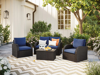 Blue outdoor loveseat set with two chairs, a coffee table, and two ottomans. Features weather-resistant cushions, rattan wicker frames, and a modern design perfect for patio or garden seating.