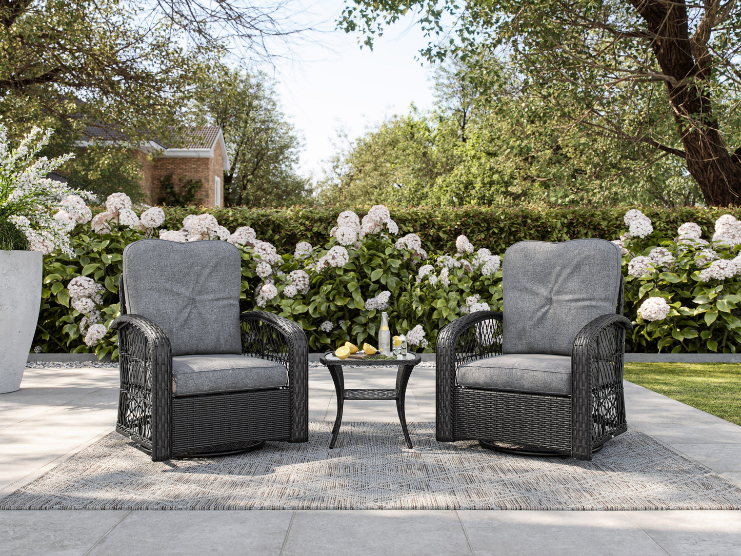 Grey swivel patio chairs set, 3-piece, featuring durable metal frames, comfortable cushions, and a matching side table. Ideal for outdoor use, the set offers a modern design with weather-resistant materials.