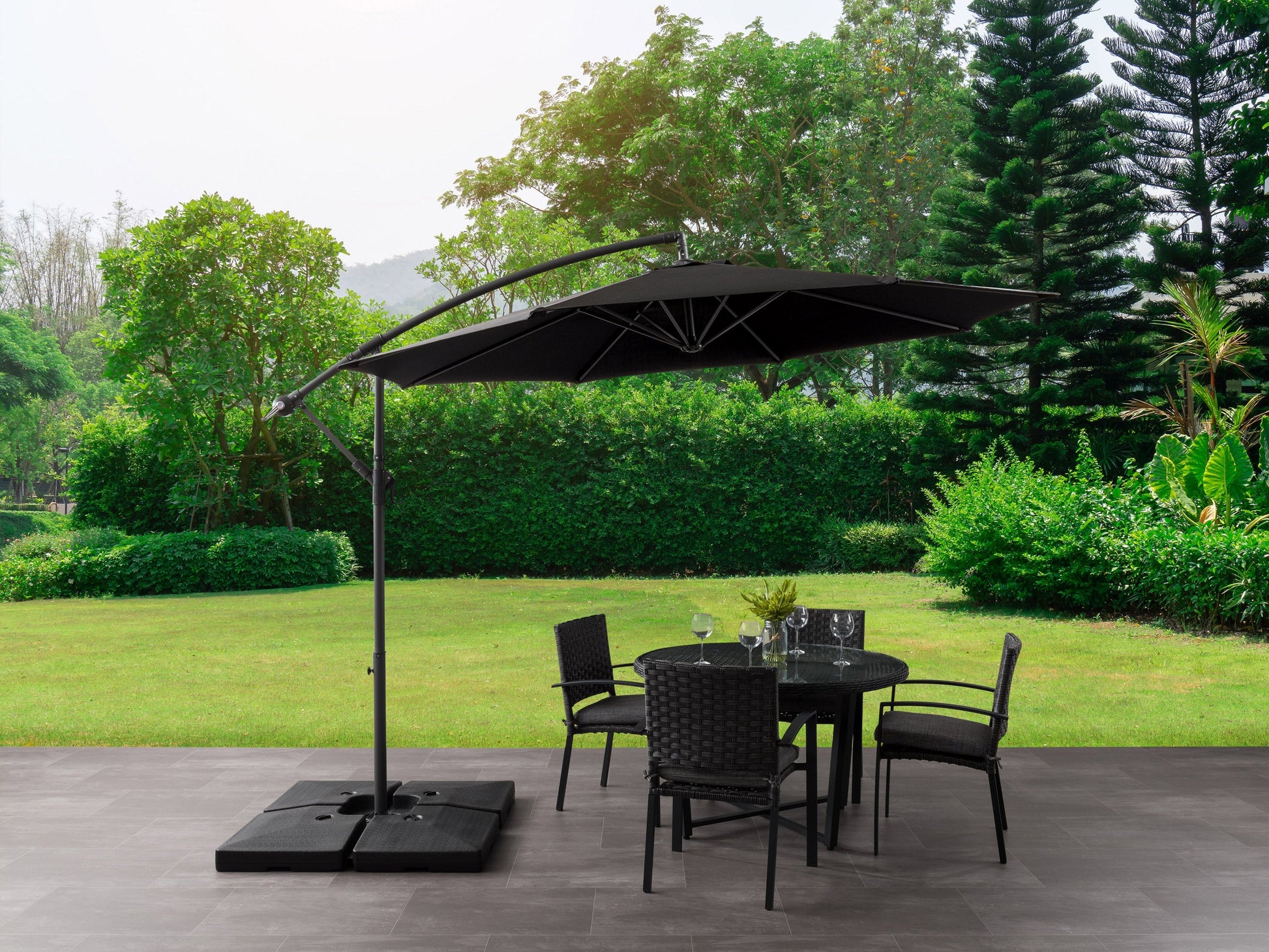 9.5ft tilting offset patio umbrella with black canopy, sturdy aluminum frame, and crank lift system, perfect for outdoor shade on patios or decks.