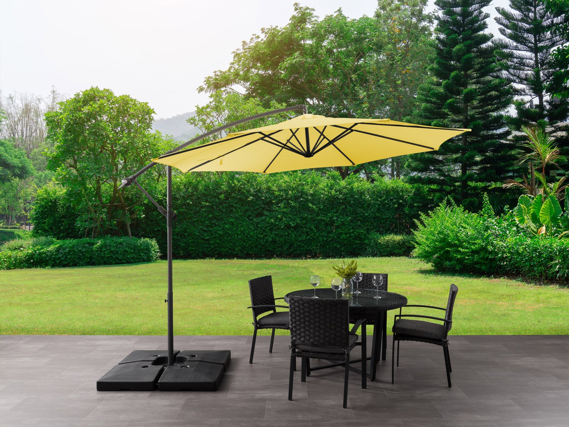 Yellow 9.5ft tilting offset patio umbrella with sturdy metal frame, adjustable tilt mechanism, and weather-resistant fabric, providing ample shade for outdoor spaces.