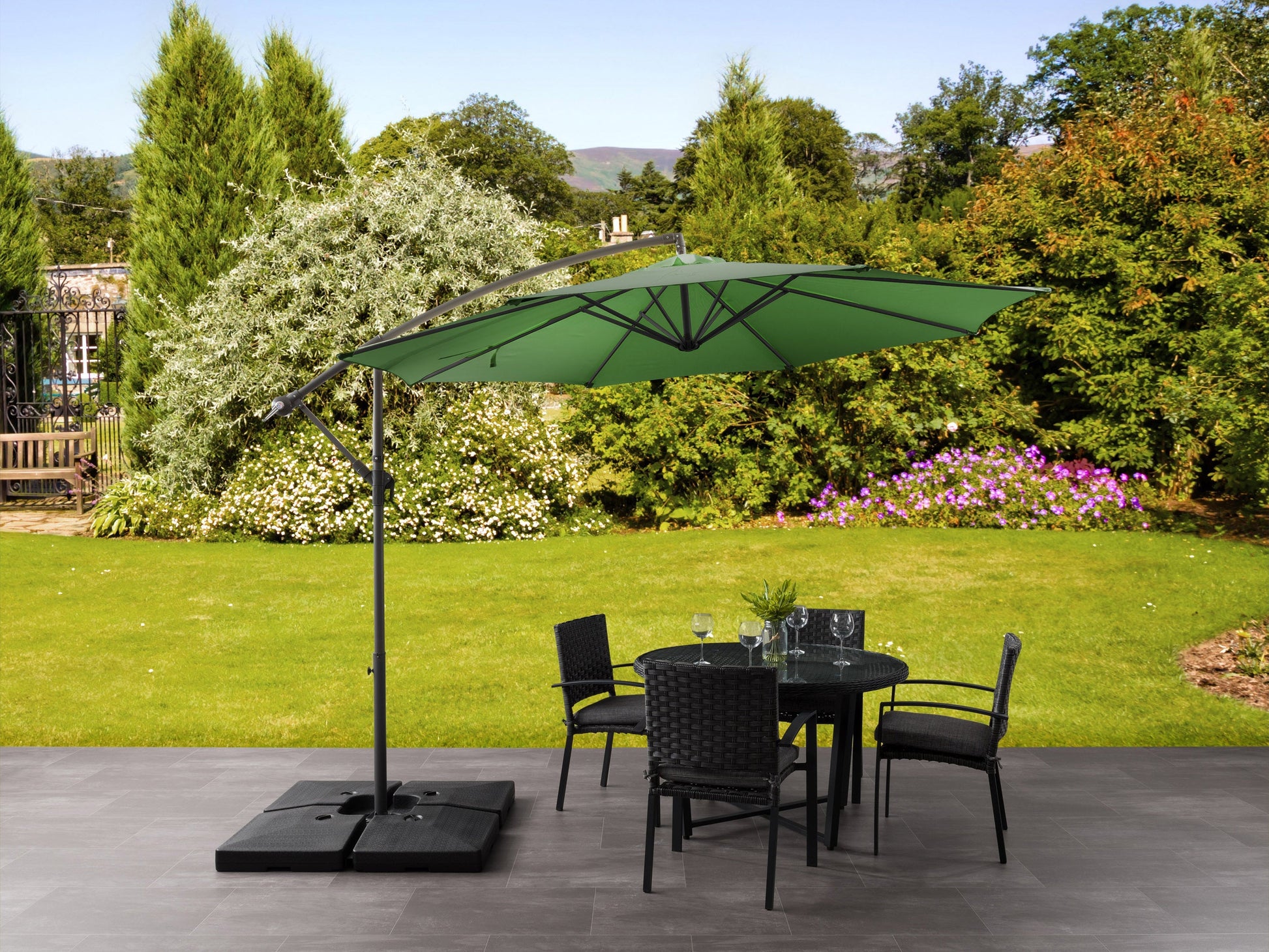 Forest green 9.5ft tilting offset patio umbrella with durable aluminum frame, UV-resistant polyester canopy, and crank lift system for easy adjustment. Perfect for outdoor shading on patios and gardens.