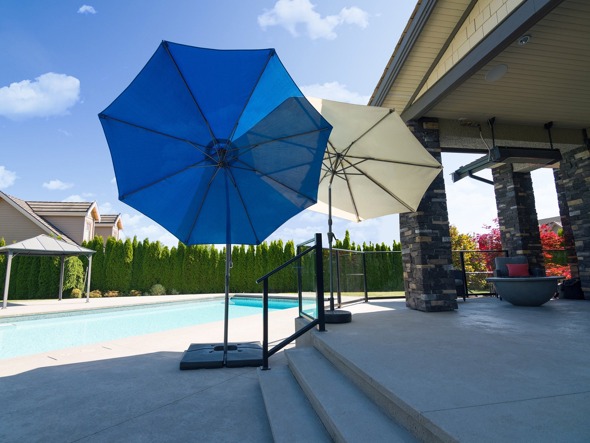 9.5ft cobalt blue tilting offset patio umbrella with durable aluminum frame, crank lift, and vented canopy for optimal shade and airflow in outdoor settings.