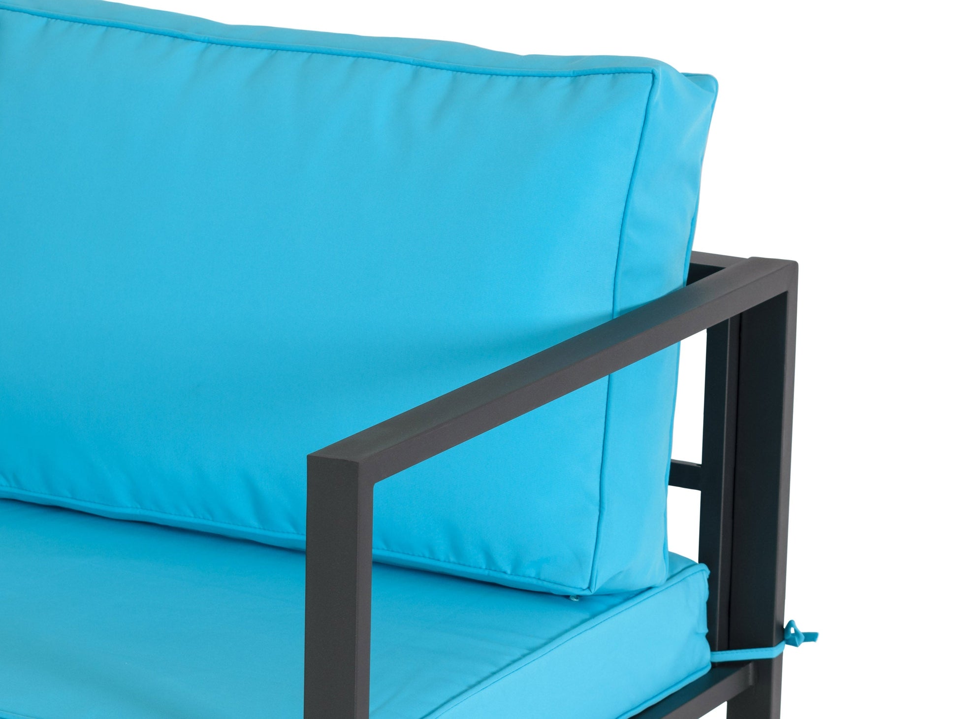 Turquoise 4-piece patio conversation set with cushioned seating, wicker frame, glass-top coffee table, and vibrant pillows, perfect for outdoor lounging and entertaining.