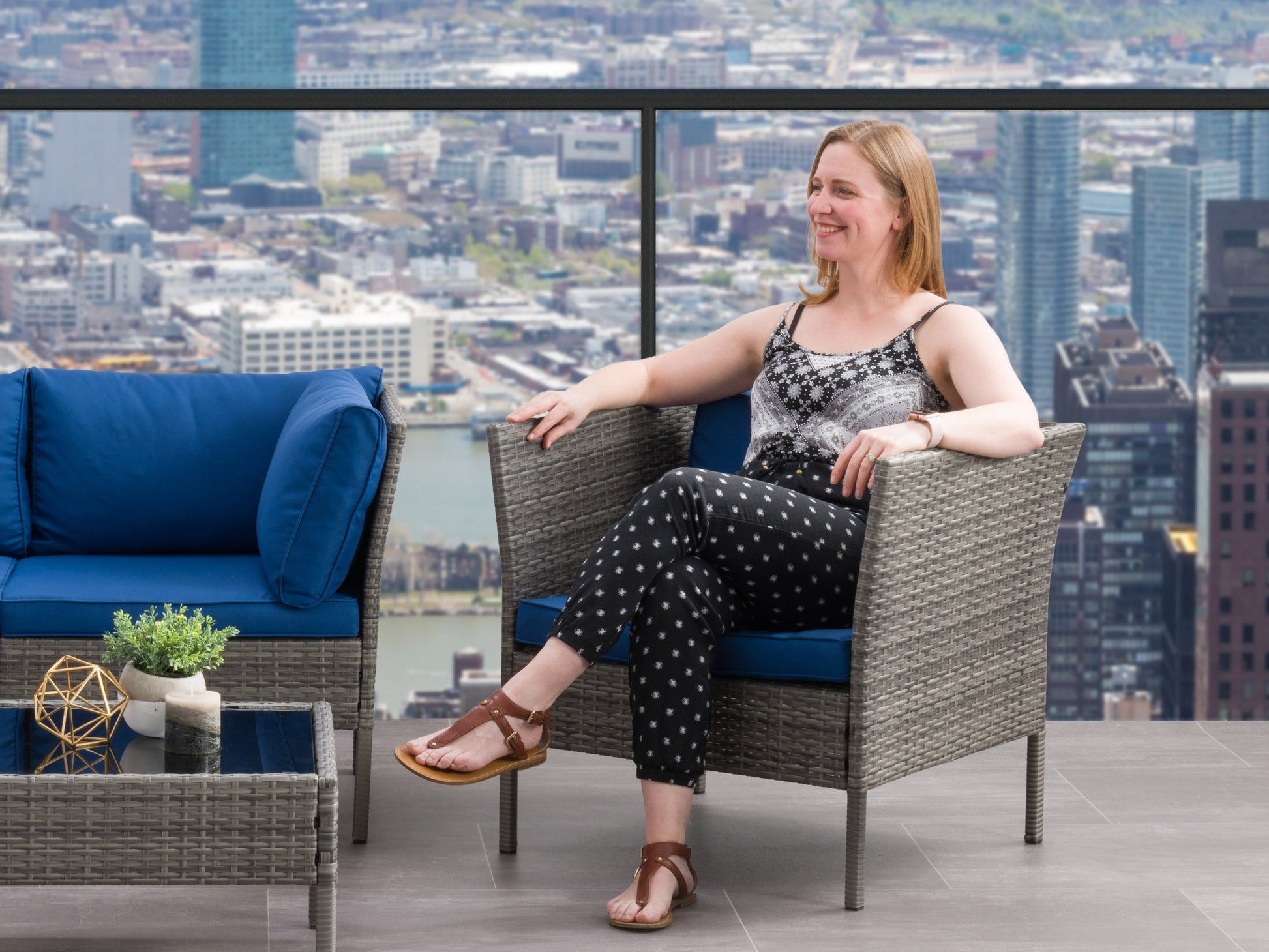 Grey and blue patio armchair with cushioned seat and backrest, featuring a sturdy metal frame and weather-resistant fabric, perfect for outdoor relaxation and garden seating.