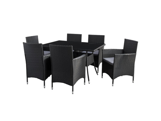 Gray wicker patio dining set with six cushioned chairs, rectangular glass-top table, and weather-resistant materials, perfect for outdoor dining and entertaining.