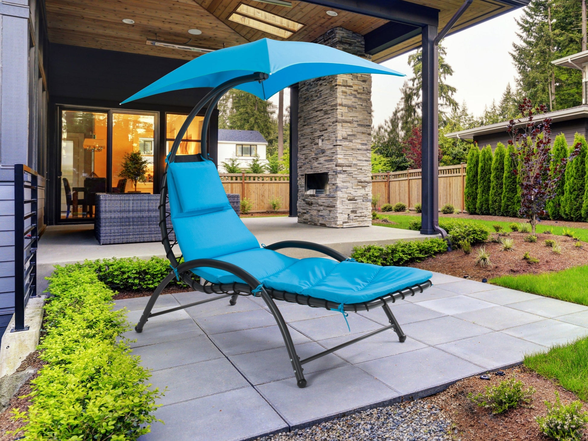 Blue patio lounge chair with adjustable canopy, featuring a sturdy metal frame, weather-resistant fabric, and comfortable cushioning. Ideal for outdoor relaxation and sun protection.