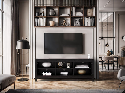 Black media console with sleek design, supports TVs up to 85 inches, features two spacious cabinets, open shelving for electronics, and cable management system. Matte black finish with modern metal handles.