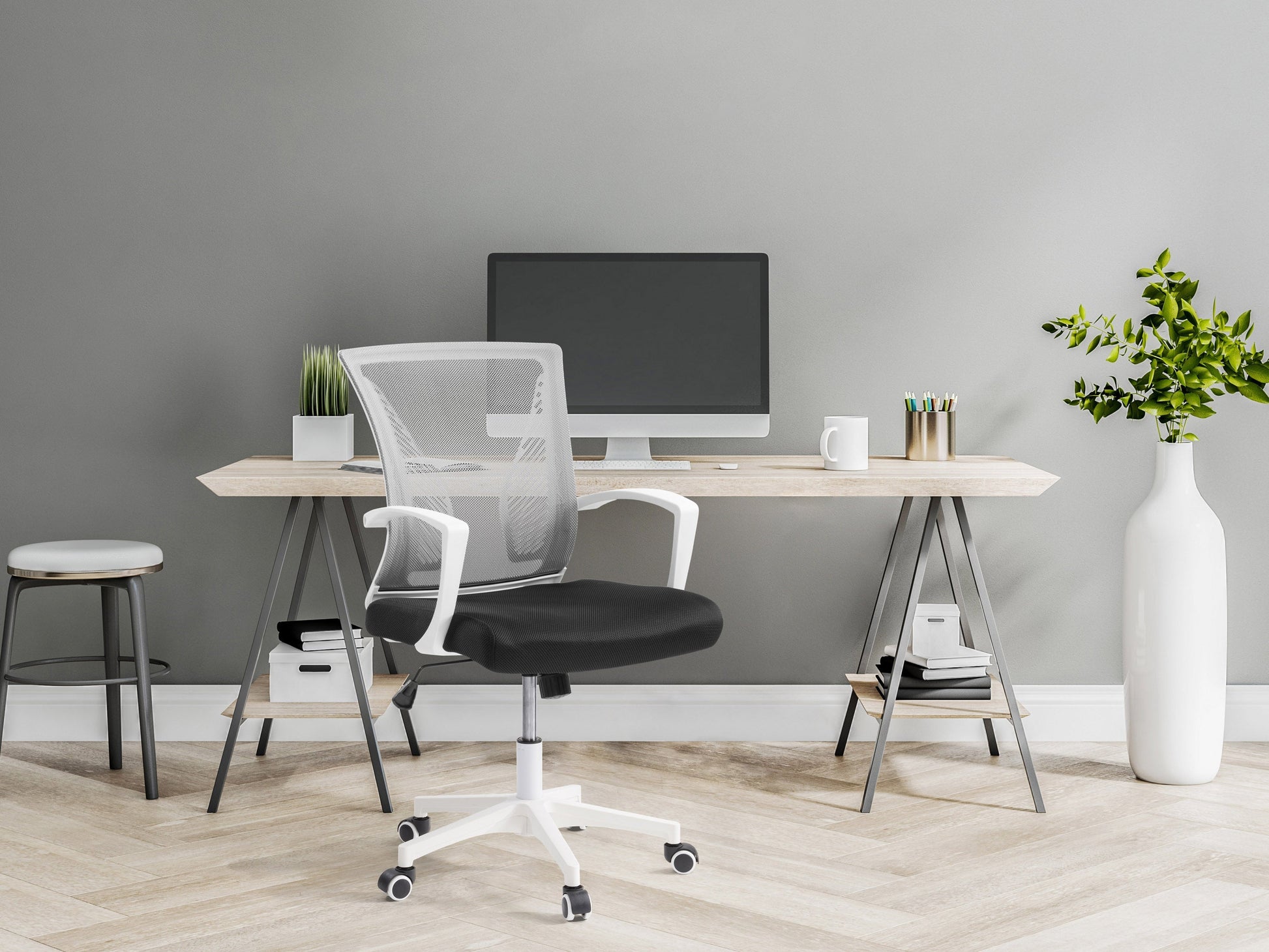 Grey mesh task chair with white frame, ergonomic design, adjustable armrests, and lumbar support. Ideal for office use, featuring breathable mesh backrest and cushioned seat for comfort and style.