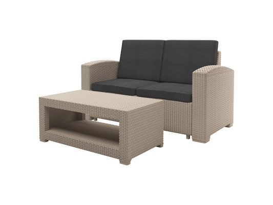 Outdoor wicker loveseat with beige cushions, brown rattan frame, and weather-resistant materials. Ideal for patio conversation sets, featuring comfortable seating and a stylish, durable design for outdoor relaxation.