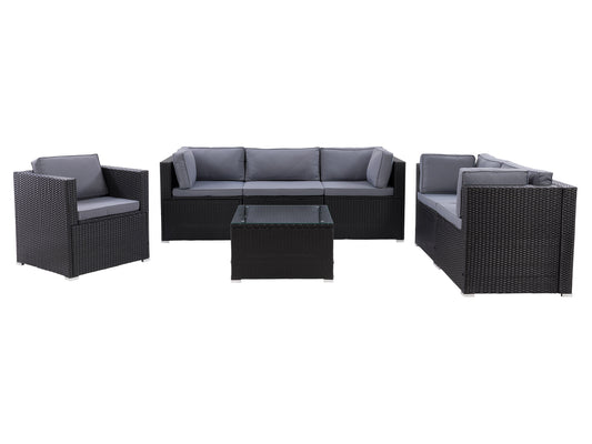 7-piece outdoor patio conversation set with gray wicker, beige cushions, and tempered glass coffee table. Includes sectional sofa, ottoman, and two armchairs. Weather-resistant materials for durability.