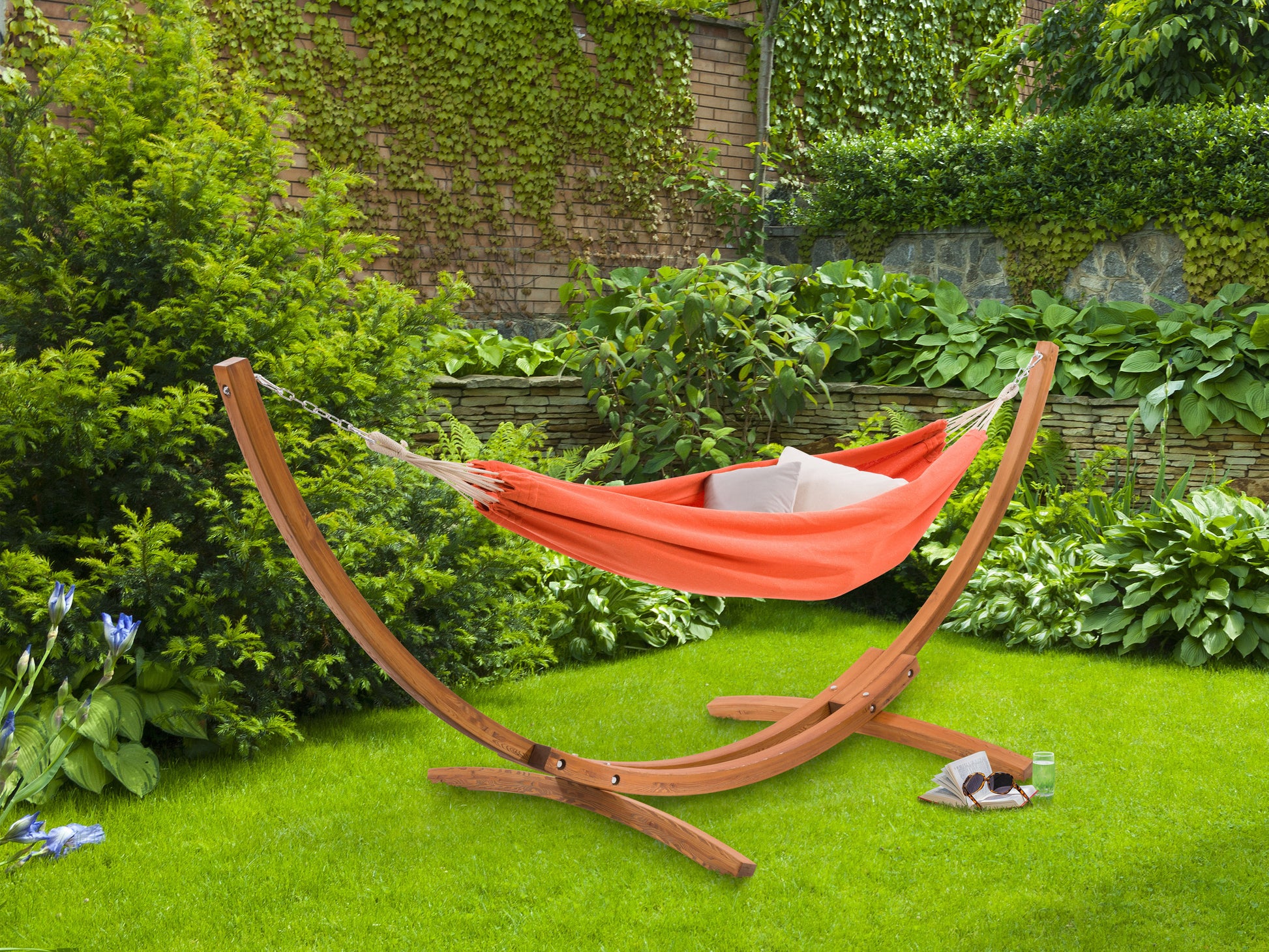 Wooden stand hammock with beige fabric, featuring a sleek, curved design perfect for outdoor relaxation. Durable wood frame and soft, weather-resistant material ideal for patios and gardens.